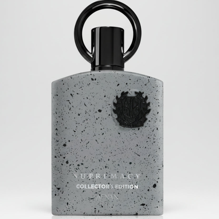 Perfume bottle with speckled gray design and black cap on a white background