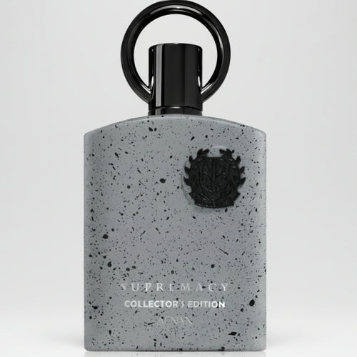 Perfume bottle with speckled gray design and black cap on a white background