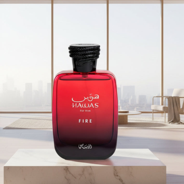 Red perfume bottle labeled 'Hawas for Him Fire' on a white background